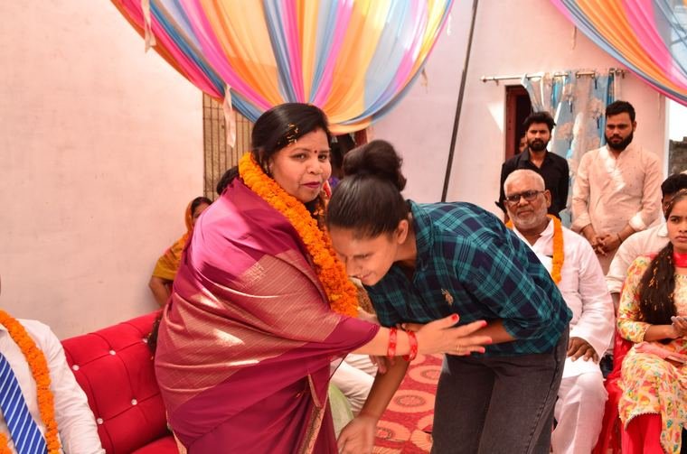 Felicitation with tilak and garland